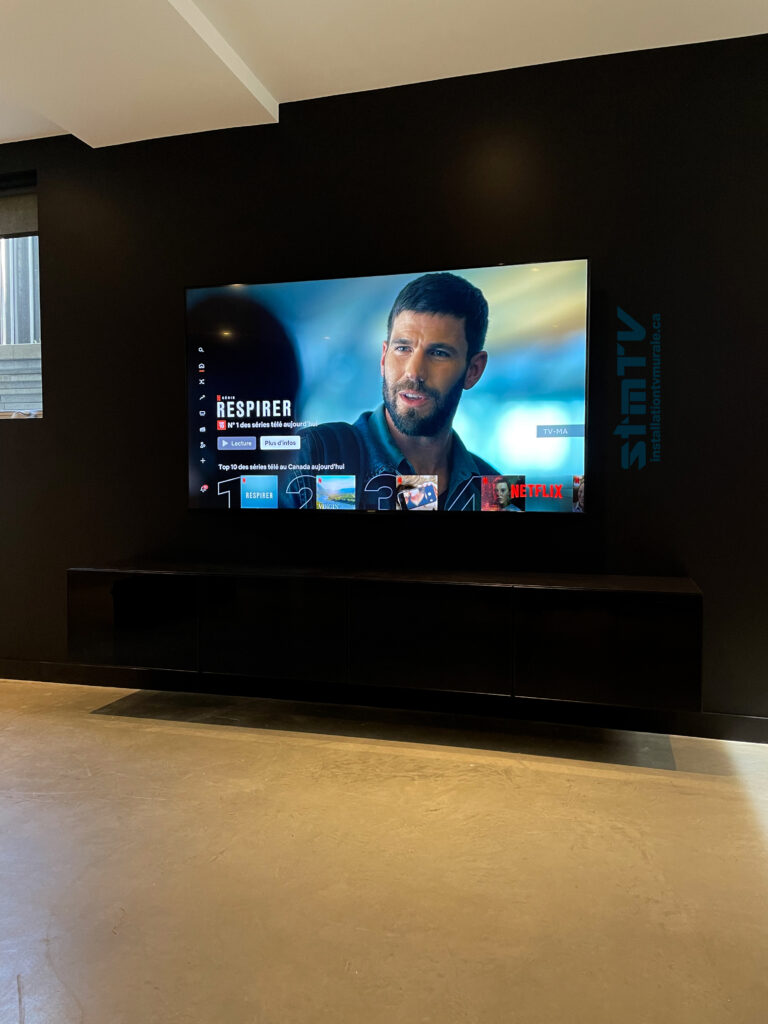 big tv on the wall with 2 besta fixed on the wallbest tv installer montreal